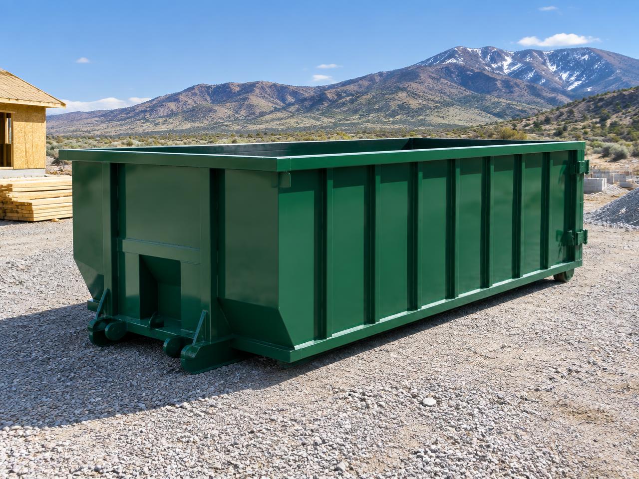 Green roll-off dumpster ready for a Nevada construction project